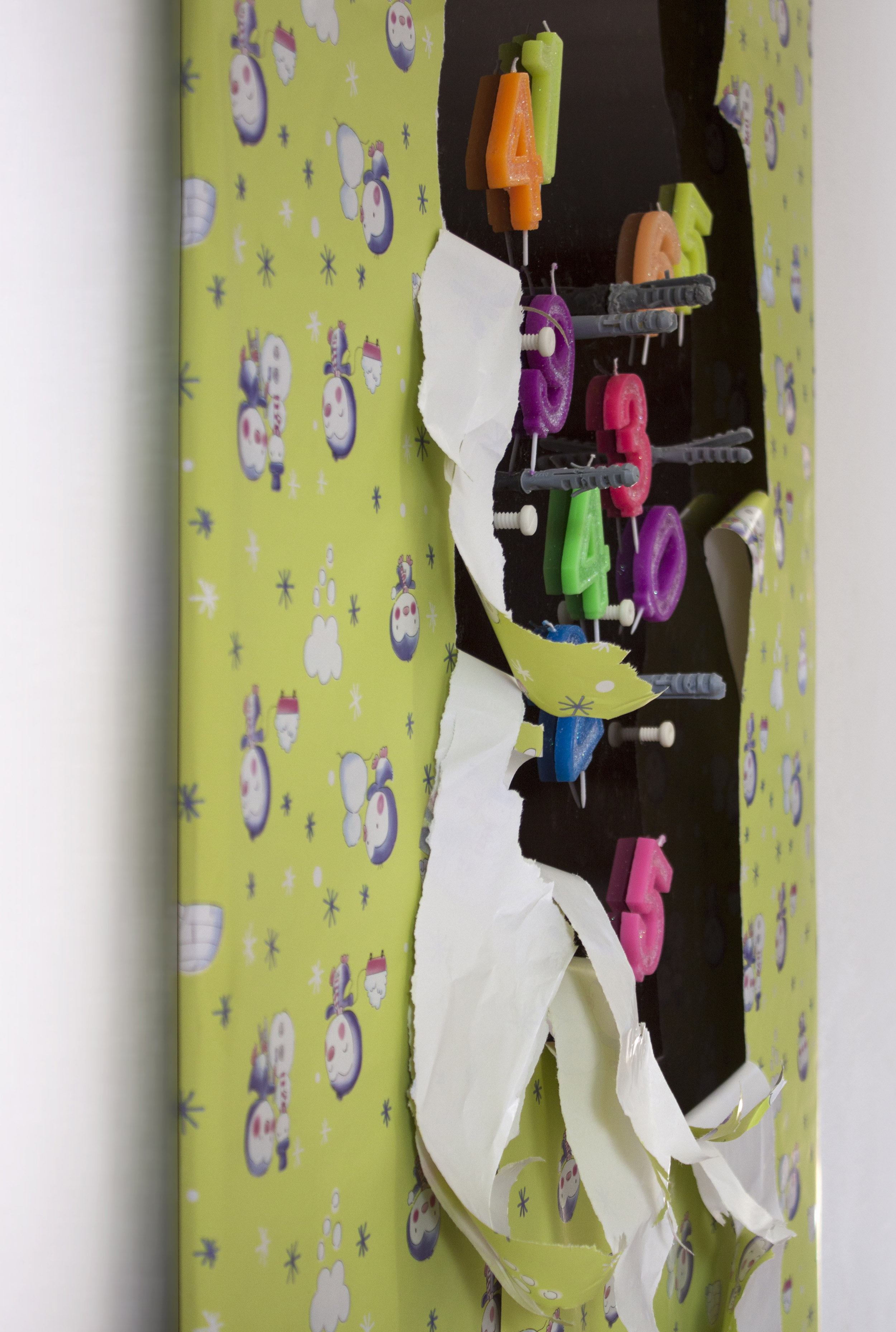 Work No. 1, 2019 Polymethyl methacrylate panel, birthday candles, wall plugs bitten by dog, 3D-printed screws (ABS), wrapping paper and wall dust 180 x 90 x 5 c