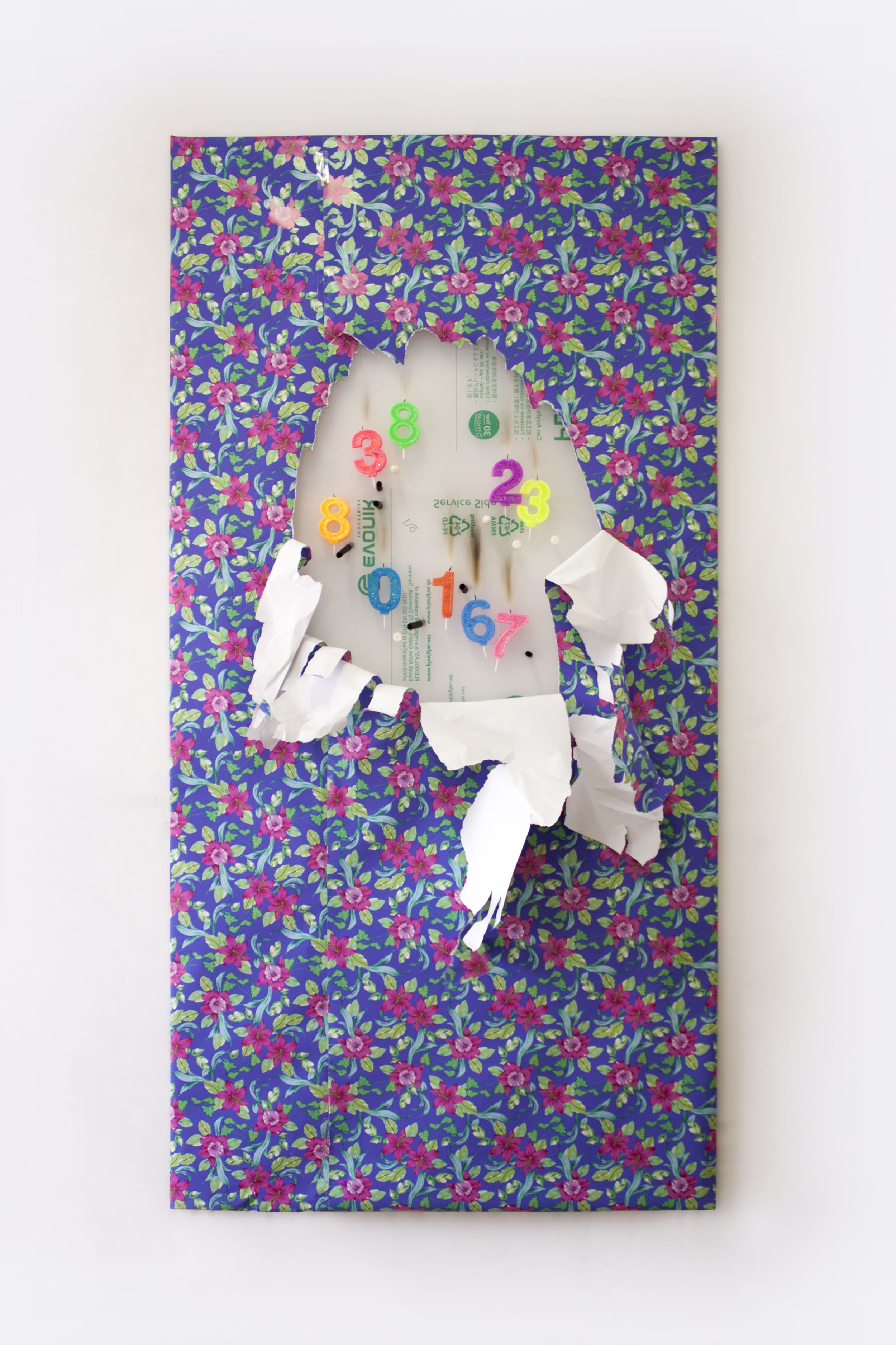 Work No. 2, 2019 Polymethyl methacrylate panel, birthday candles, charcoal, 3D-printed screws (ABS), wrapping paper and wall dust 180 x 90 x 5 cm