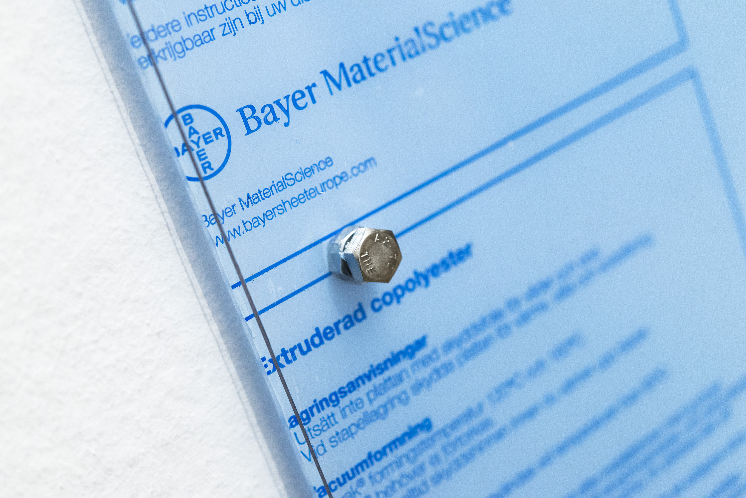 Oriented Combustions (Bayer in Leverkusen, 1988, and Bayer in Elberfeld, 1881), 2016 Two polyester panels, industrial screws, 3D-printed screws (ABS), soot and 